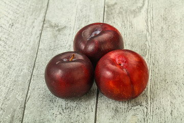 Ripe sweet plum fruit heap