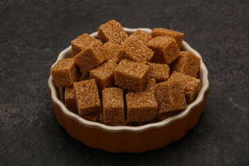 Cane sugar cubs in the bowl