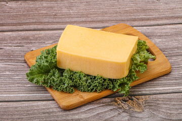 Tasty yelloow Tilsiter cheese brick