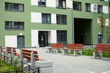 view on new modern residental buildings, modern backjard , windows on green and white wall