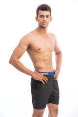 Fototapeta premium healthy athletic young man showing muscle isolated on white.