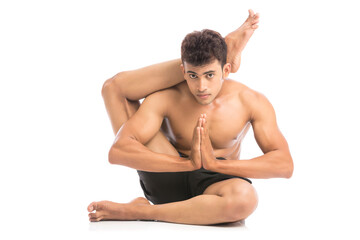 Fototapeta na wymiar Young man is doing yoga isolated over white background