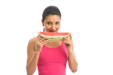 Beautiful woman eating watermelon on white background.