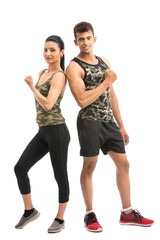 Obraz premium Two sportive people in sportswear showing their biceps, isolated on white background