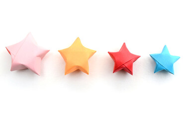 Four different origami stars on row