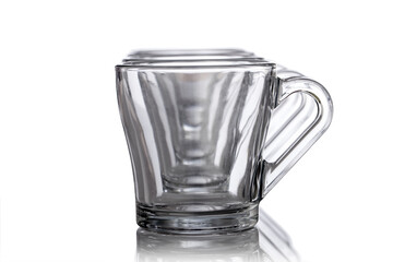 Empty glass tea cups arranged on white background