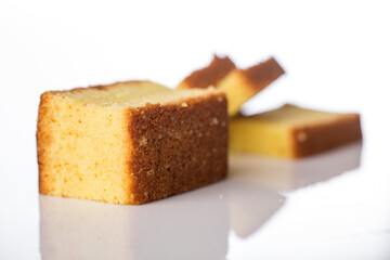 Butter cake sliced on white background