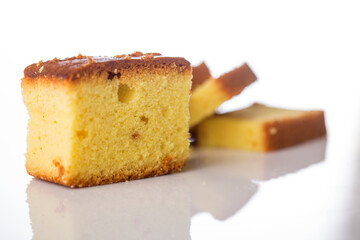 Butter cake sliced on white background