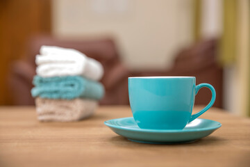 Tea cup with hand towel on table.