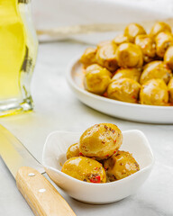 Still life with marinated olives in a bowl