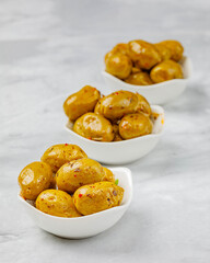 Still life with marinated olives in a bowl