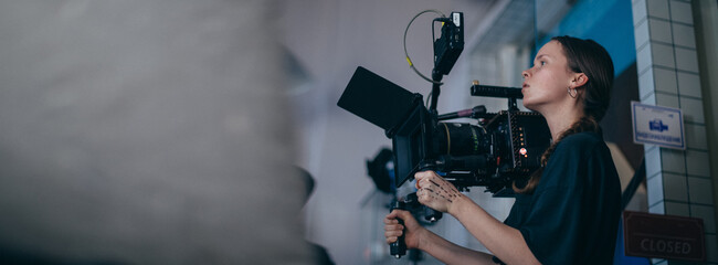 Director of photography with a camera in his hands on the set.