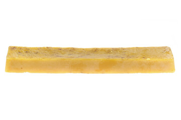 pure beeswax ingot isolated on white background