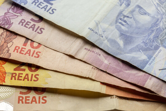 Brazilian Real used colored bank notes money close details