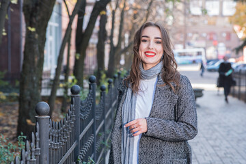 Portrait of a beautiful and happy girl outdoors. Beauty and fashion