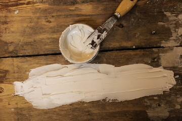 DIY, applying putty over a fatigue old wooden floor, Refurbishing floor.