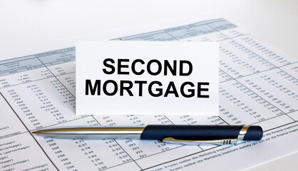 Text Second Mortgage on white card with blue metal pen on financial table