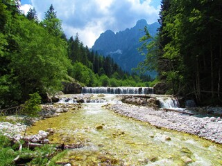 View of Krnica creek in Julian alps and triglav national park, Slovenia with mountain peak in the...