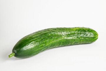 Fresh green cucumber isolated on white background