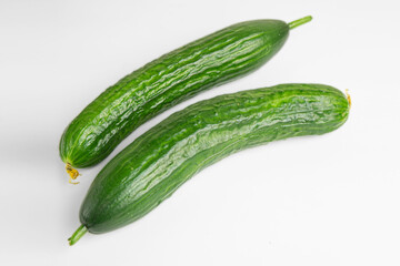 Fresh green cucumber isolated on white background