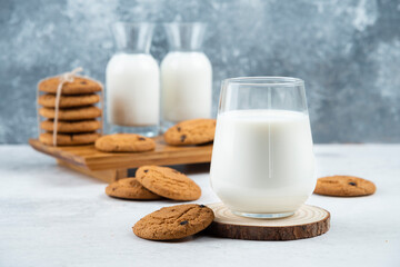 A glass and jar of milk with delicious cookies