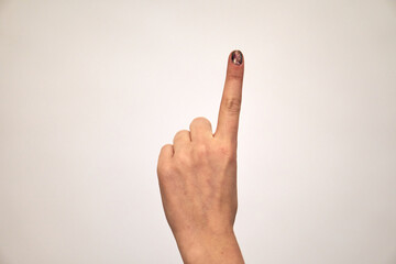 caucasian female hand shows gestures and raises a finger up. Exclamation and attention. High quality photo