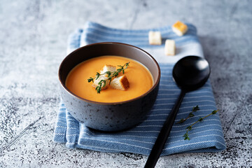 Sweet potato soup with croutons and thyme leaves