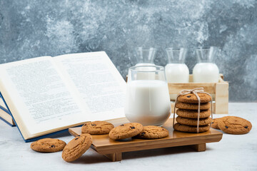 A glass and jar of milk with delicious cookies