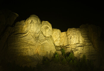 Mount Rushmore illuminated at night