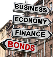 The road indicator on the arrows of which is written - business, economics, finance and BONDS