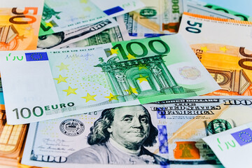 Paper banknotes of Euro 50 and 100. Cash close-up, color background of money view from above...