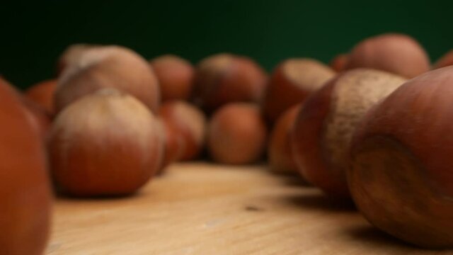 extremely close-up, detailed. background texture food. many hazelnuts on a dark background