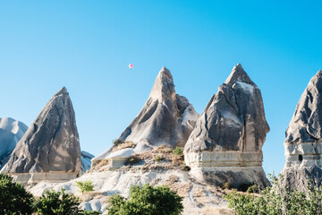 Fairy chimneys in Cappadocia. A view from the mysterious city of Cappadocia. Fairy chimneys with selective focus.