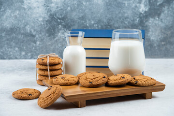 A glass and jar of milk with delicious cookies