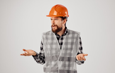 Man in construction uniform orange hard hat emotions of a construction professional