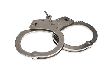 Pair of steel handcuffs isolated on white background. Silver metal handcuffs on white