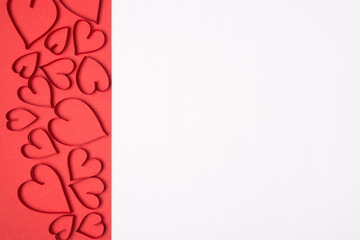 Background made of red hearts on red background and white part for text copy empty blank space