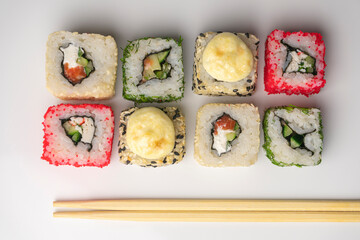 four pieces of sushi on a white background. the view from the top
