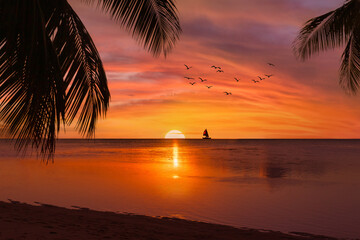Tahiti sunset with sailboat and palm trees