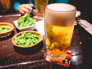 Big 1 liter beer jar and japanese Edamame green beans (with salt and butter), Tokyo, Japan