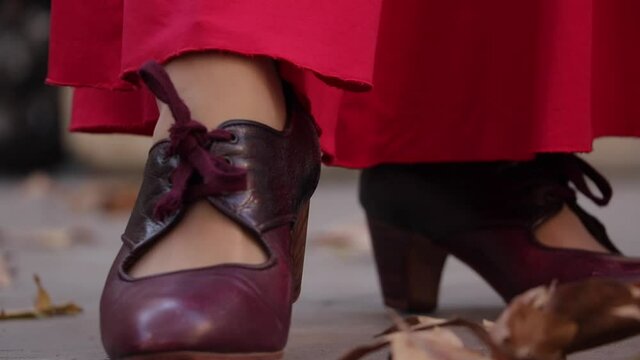 close up photo of a young Spanish woman dancing flamenco with her high heels.