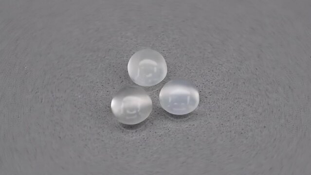 natural white moonstones adular gems on the background