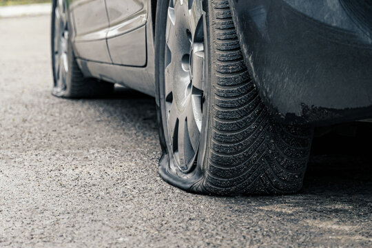 Flat Car Tire Close Up, Punctured Wheel