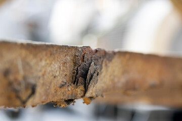 Obraz premium Close up view of the corrosion on exposed carbon steel material. Rusting, the formation of iron oxides, is a well known example of electrochemical corrosion.
