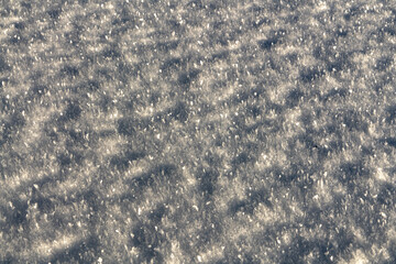 Close up, macro shot of ice, frost on the surface of a lake in winter season, during cold frozen time. Graphic resource, black background photo. 