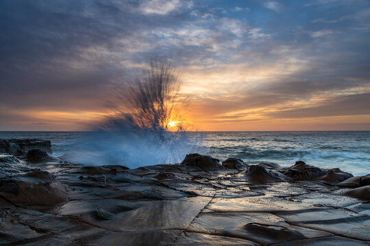 High Cloud Sunrise Seascape from Rock Platform © Merrillie
