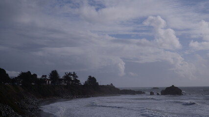 Ocean waves hitting to the cliff rocks