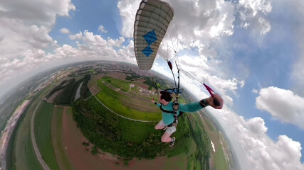 Unique images of a parachutist making selfie. Used a special camera with fish eye lens. Artistic...