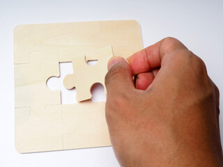 picture of wooden puzzle, a game that also for kids educational 