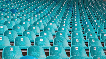 Obraz premium Abandoned premise with rows of old blue plastic seats